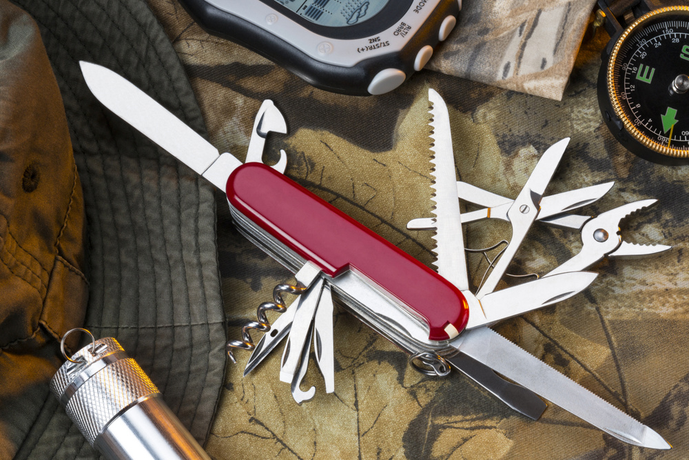 A Swiss Army style of mulitool knife and equipment for the great outdoors