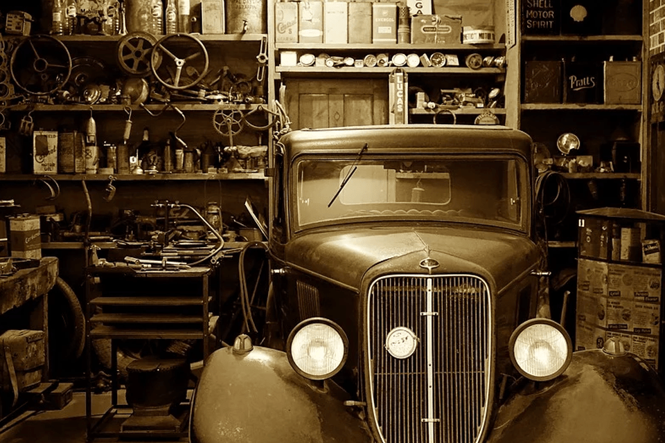 vintage car parked inside the garage