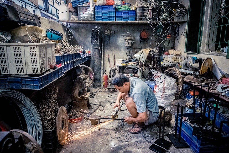 man working in a shop